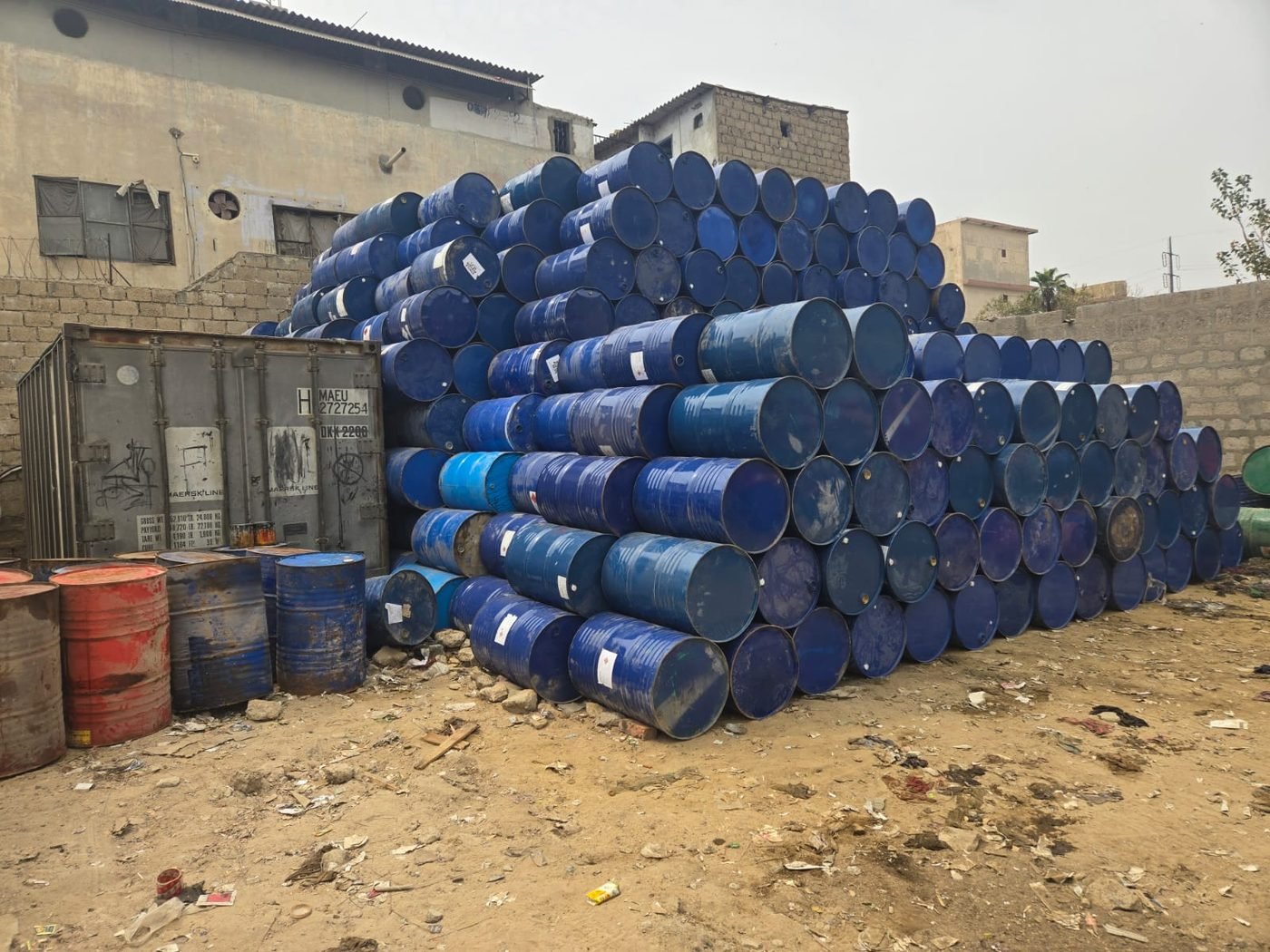 Steel drums and containers in the Zyema Packages yard Karachi