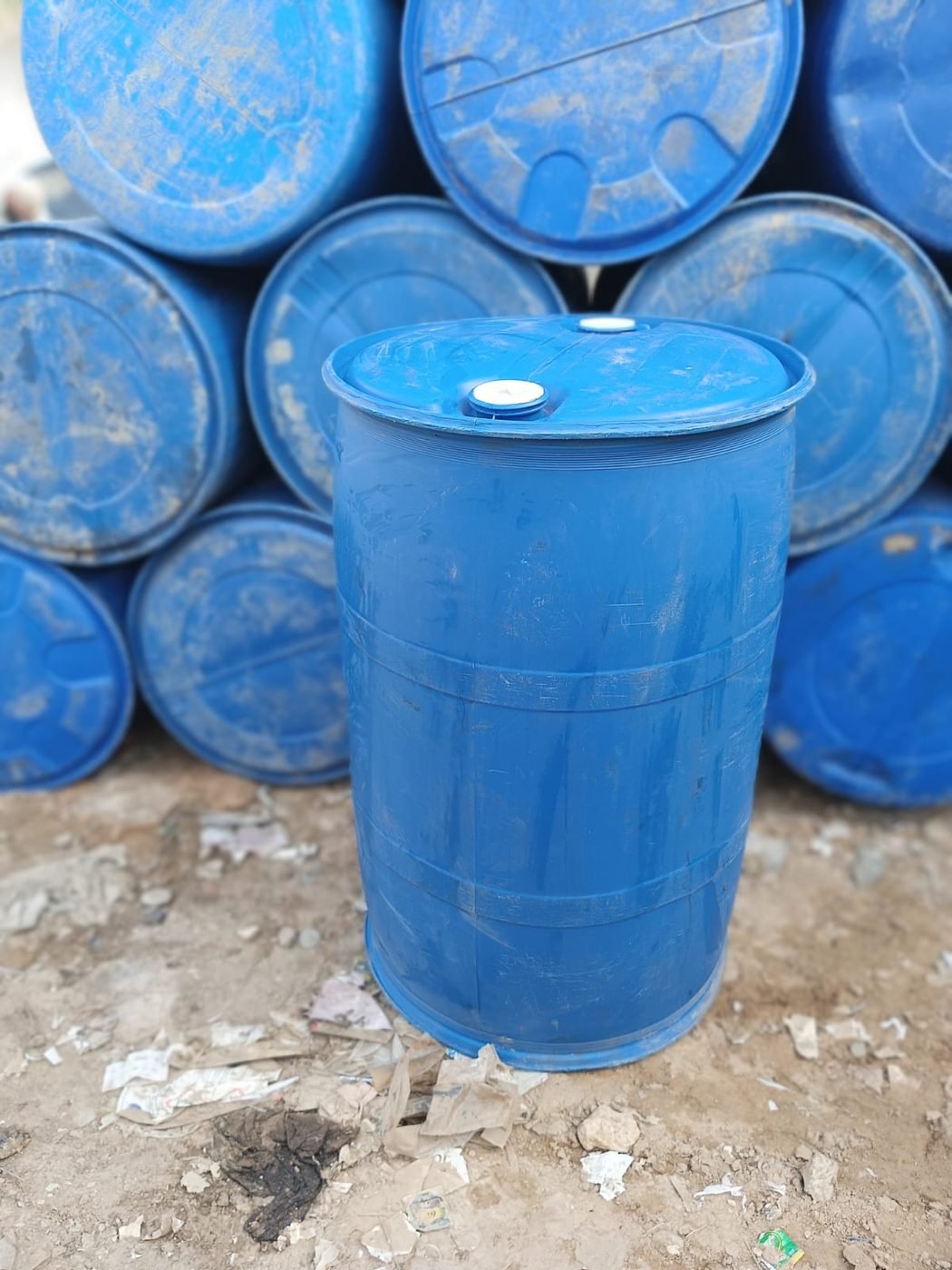 210 litre steel drums stacked for supply across Pakistan